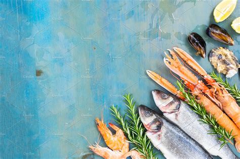 Fresh seafood on blue background | Food Images ~ Creative Market