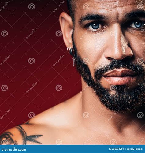 Handsome Blue Eyed Cuban Or Latino With Beard Looks Straight Into