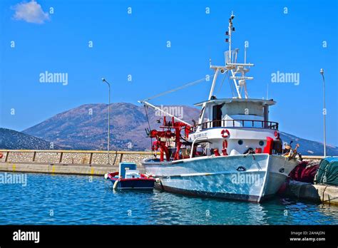 Modern Greek Fishing Boat Moored In The Harbour Of The Beautiful