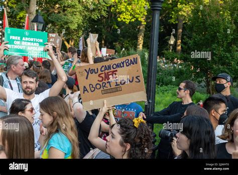 The Protesters Holding Cardboard Signs After Supreme Court Overturned