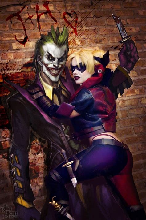 The Joker And Harley Are Hugging In Front Of A Brick Wall