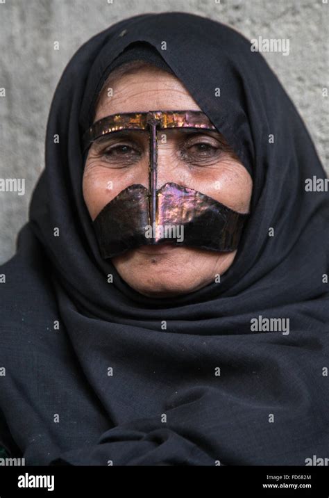 A Bandari Woman Wearing A Traditional Mask Called The Burqa With A