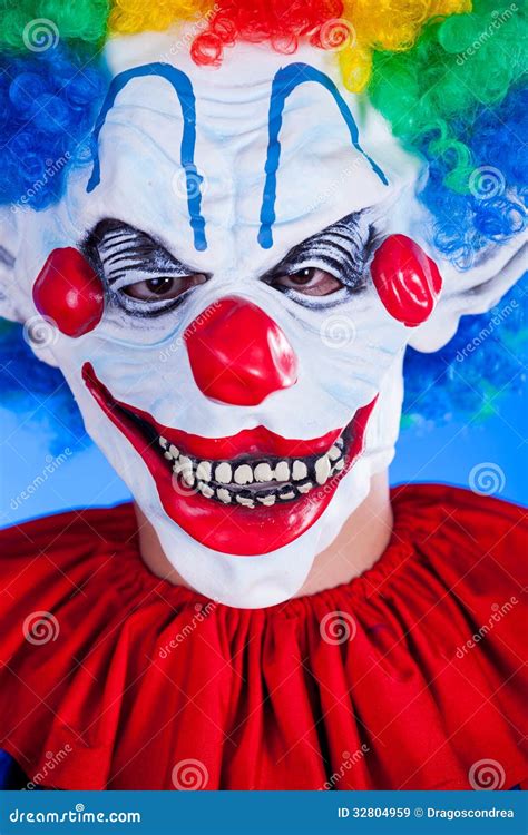 Scary Clown Person In Clown Mask On Blue Background Stock Image Image