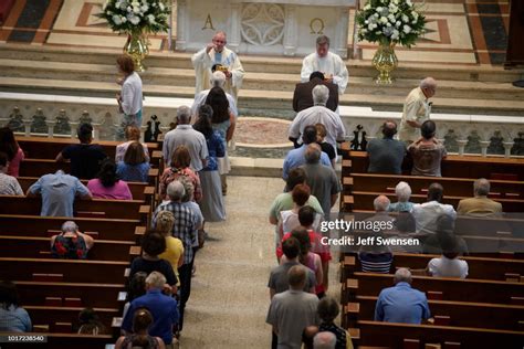 Parishioners Worship During A Mass To Celebrate The Assumption Of The