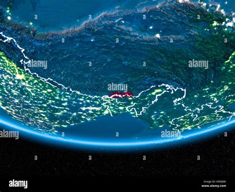 Bhutan In Red With Visible Country Borders And City Lights From Space