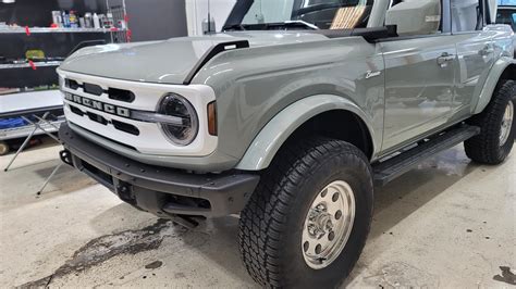 Retro Build Outerbanks Bronco Featuring White Roof Grill Stripes