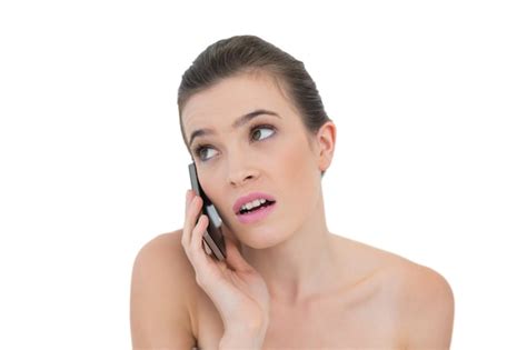 Premium Photo Puzzled Natural Brown Haired Model Making A Phone Call