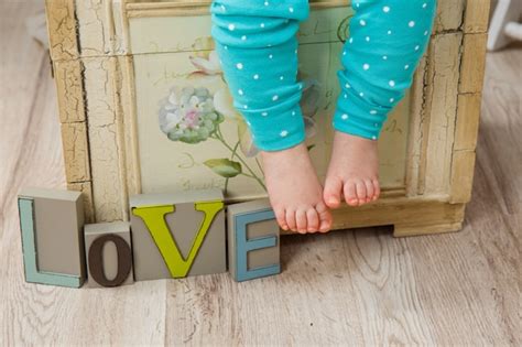 Charming Naked Legs Of Baby Premium Photo