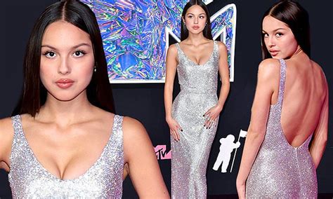 Olivia Rodrigo Dazzles In A Plunging Sparkly Silver Gown As She Arrives