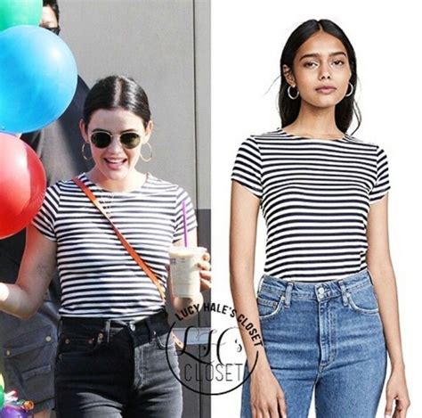 Two Women In Striped Shirts And Jeans With Balloons On The Side One