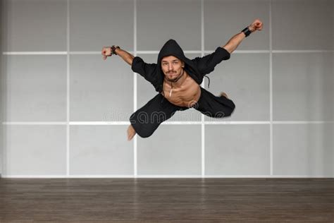 Handsome Male Dancer In A Black Dress With Naked Torso Stands Stock Image Image Of Fitness