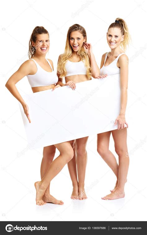 Group Of Happy Friends Posing In Underwear Stock Photo Macniak