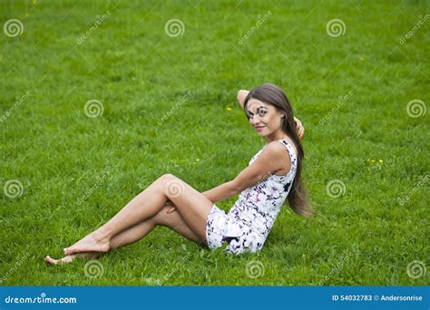 Woman In Short Dress Sitting On Green Grass Stock Image Image Of