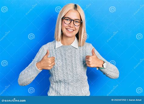 Beautiful Blonde Woman Wearing Glasses Success Sign Doing Positive