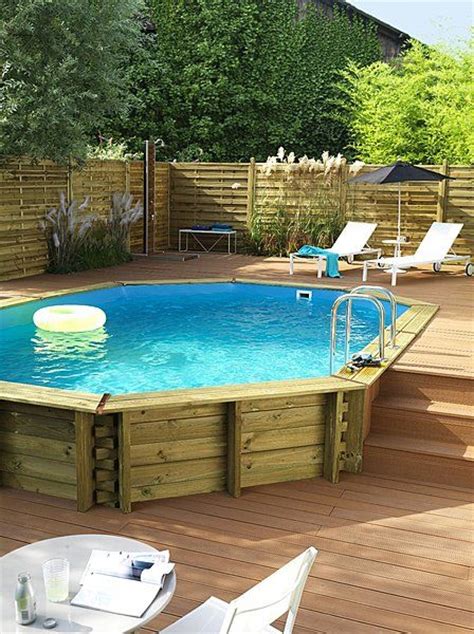 An Above Ground Pool Surrounded By Wooden Decking