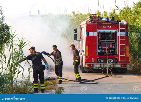 Firefighter Extinguishing Fire In Sicily Editorial Photography Image