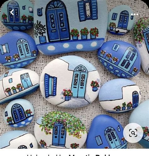 Blue And White Painted Rocks With Windows And Flowers On Them Are