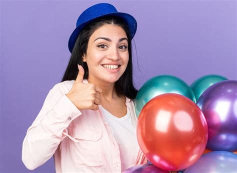 Free Photo Smiling Young Beautiful Woman Wearing Party Hat Holding