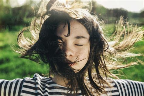 Girl With Hair Blowing In The Wind