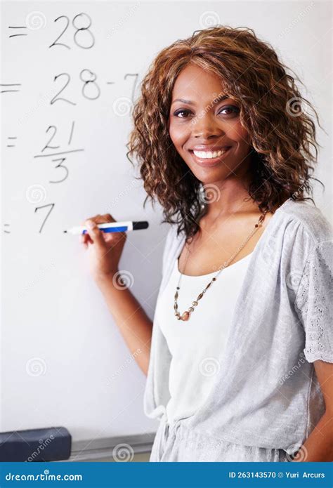 Maths Teacher A Gorgeous Young Maths Teacher Writing A Sum On A