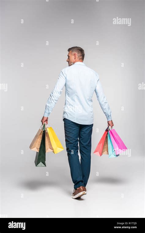 Man Carrying Shopping Bags Hi Res Stock Photography And Images Alamy