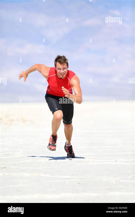 Runner Man Running Sprinting Outdoor In Desert Nature Fit Athlete In