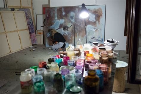 An Art Studio Filled With Lots Of Different Colored Paints