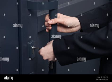 Woman Unlocking Door With Key Hi Res Stock Photography And Images Alamy