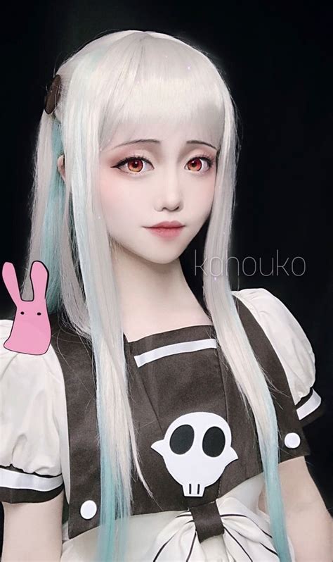 An Anime Girl With Long White Hair And Pink Bunny Ears Wearing A Black