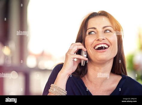 You Just Made My Day A Woman Laughing While Talking On Her Cellphone