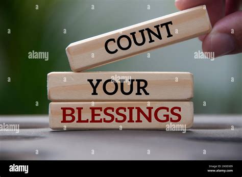 Count Your Blessings Text On Wooden Blocks With Blurred Park Background