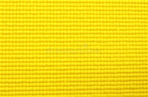 Fondo Amarillo De La Textura De La Estera De La Yoga Foto De Archivo