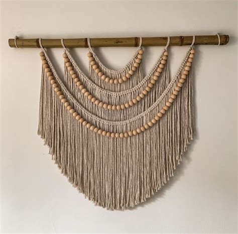 The Wall Hanging Is Made From Wood Beads And Tasselled With Wooden Beading