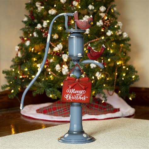 Old Style Blue Iron Water Pump With Merry Christmas Sign