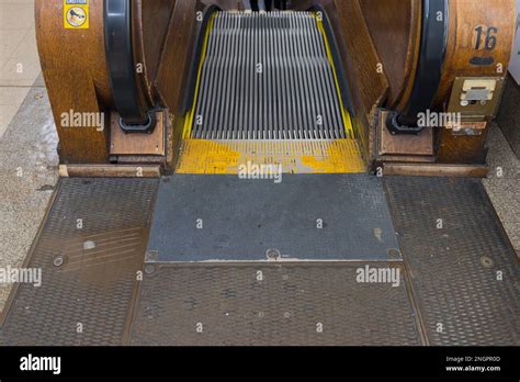 Close Up View Of Wooden Escalator Stairs Down In Department Store New