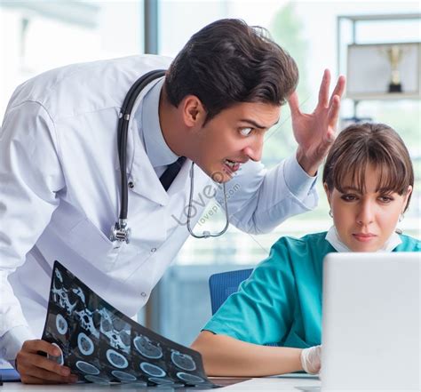 Two Doctors Discussing X Ray And Mri Image In Hospital Picture Picture