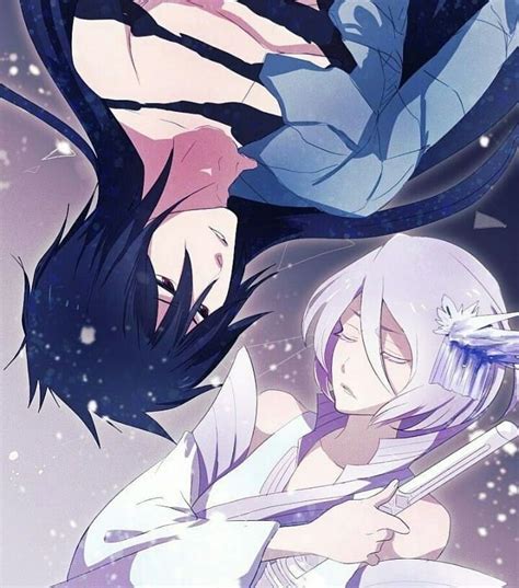 Two Anime Characters One Is Holding A Feather