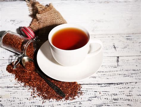 Premium Photo Cup Of Tasty Rooibos Tea On Old White Wooden Table