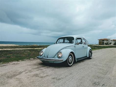 Hd Wallpaper Vw Beetle Teal Volkswagen Beetle On Road During Daytime