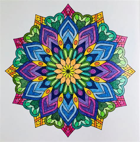 A Drawing Of A Colorful Flower On White Paper