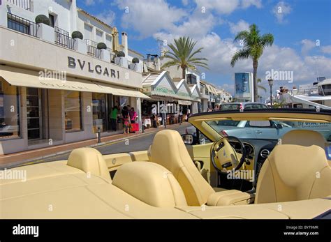 Luxury car and shops at the exclusive yacht harbour of Puerto Banús