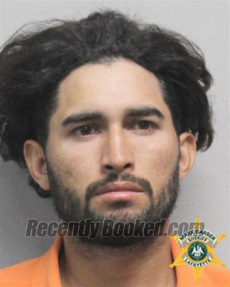 Recent Booking Mugshot For Miguel Flores In Lafayette Parish Louisiana