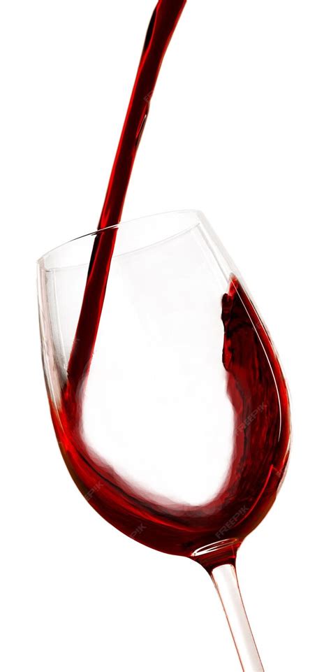 Premium Photo Pouring Red Wine Into A Glass Isolated