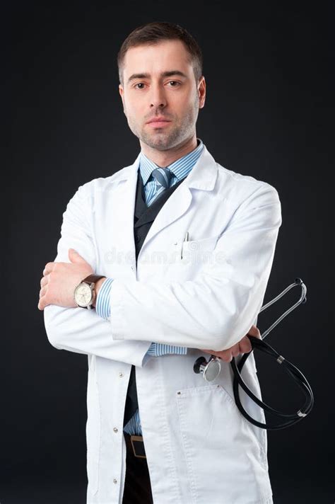 Handsome Serious Male Doctor Holds Stethoscope Stock Photo Image