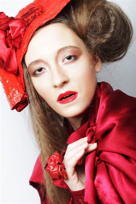 Young Beautiful Woman In A Red Lace Suit And Hat Stock Photo Image