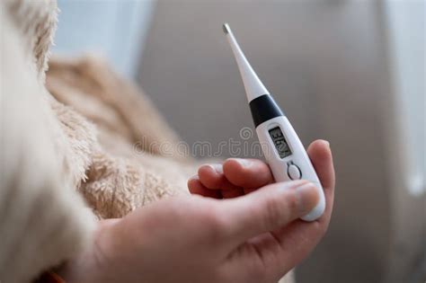 Close Up Shot Of A Man Looking At Thermometer Male Hands Holding A