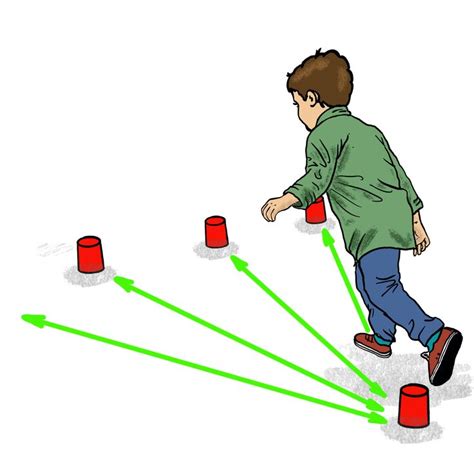 A Man Is Playing With Red Cups And Green Arrows On The Ground In Front