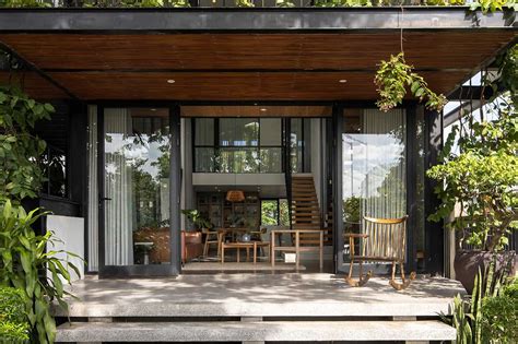 A Glass Stacked House In Vietnam Shrouded In Greenery