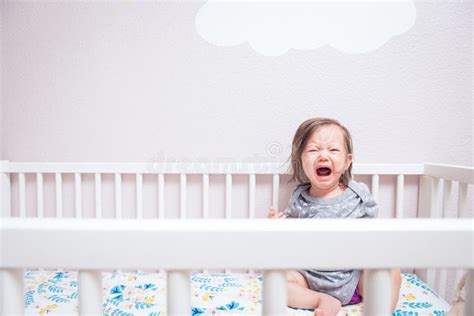 Baby Crying in Crib stock image. Image of face, waking - 55038727