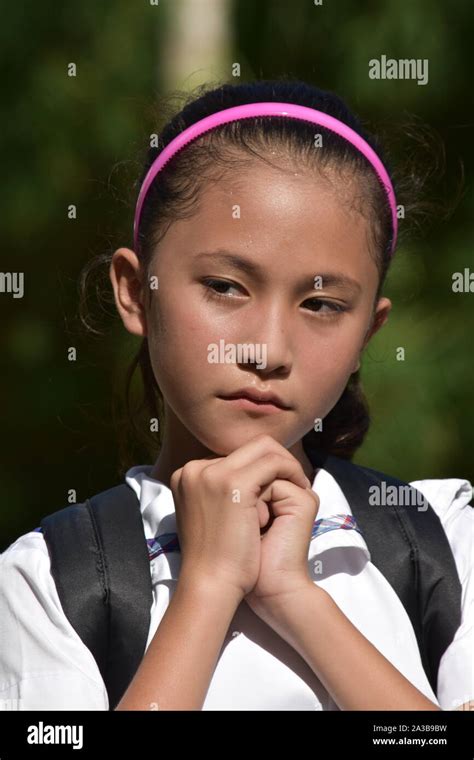 Praying Diverse Girl Student With Books Stock Photo Alamy